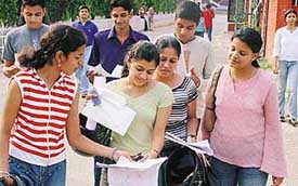 Students outside the examination centre at DAV College in Sector 10, Chandigarh, on Sunday after appearing in a test