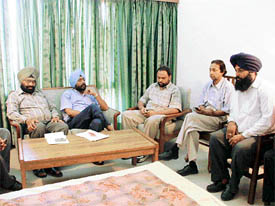 Representatives of the district administration and the DMC Employees Union hold discussions in Ludhiana