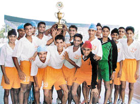 Players of A S Senior Secondary School, Khanna, celebrate after winning the trophy in the Ludhiana District Schools Football Tournament