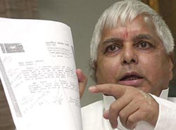Union Railway Minister Laloo Prasad Yadav addresses the media during a press conference at Rail Bhavan in New Delhi on Sunday. 