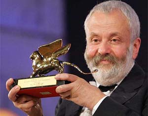 British filmmaker Mike Leigh shows the Golden Lion trophy, awarded to him for the best movie at the 61st Venice film festival