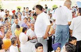Agitated parents and their wards raise slogans against the authorities of Baba Farid University, Faridkot, for not displaying the merit list of shortlisted candidates