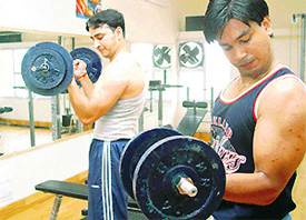 Many youths work as gym instructors to fund their studies.
