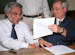 Dr Amit Ghosh, IMTECH Director, and Dr Dennis C. Jett, Dean of the International Centre of the University of Florida, exchange papers after signing an MoU in Chandigarh on Tuesday. 