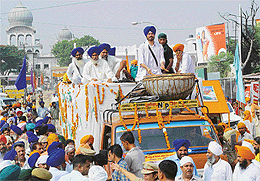 A procession carrying sacred water from Sodhra village in Pakistan being taken out from Gurdwara Nada Sahib in Panchkula on Tuesday to mark the 300th anniversary of the Bakhshish Divas of Bhai Kanhaiya. 