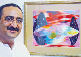 Rajesh Chadha with one of his computer graphics on display at his first exhibition which opened at Government Museum and Art Gallery, Sector 10, Chandigarh on Wednesday. 