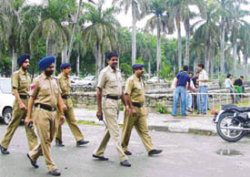 Police personnel patrol the Panjab University campus in Chandigarh on Wednesday to prevent violence in view of student council elections.