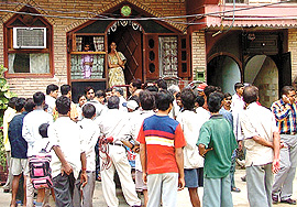 Anxious neighbours thronged the ill-fated residence of Pradeep