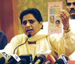 Bahujan Samaj Party president Mayawati shows party manifesto to the media in Mumbai on Wednesday.
