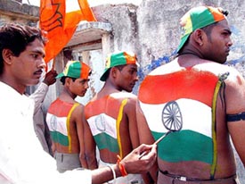 BJP workers get their body painted in the Tricolour
