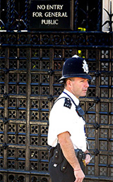 A police officer stands outside the gates of the Houses of Parliament in central London on Thursda