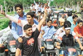 Activists of the Panjab University Students Union (PUSU) raise slogans during a rally organised on the Panjab University campus in Chandigarh on Friday.