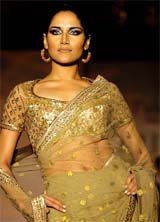 A model displays fashion designer Ritu Kumars Winter Collection in New Delhi on Friday night. 