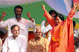 BJP leader Uma Bharti waves at the crowd