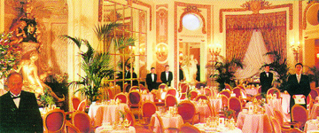 Tables set for afternoon tea at the Palm Court at the Ritz in London