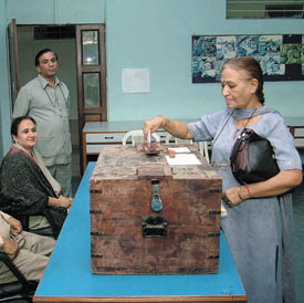 A woman casting vote for the Panjab University Senate poll at the DAV School in the Capital on Sunday.