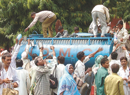 Demonstrators quenching their thirst at the Jantar Mantar in the Capital on Monday.