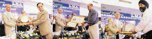 Mr Sudhir Dhingra, Mr Vinod Sahney and Mr  Ranjodh Singh receive the LMA annual awards from Governor O.P. Verma