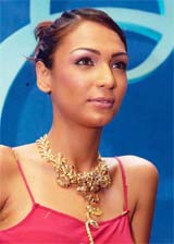 An Indian model displays diamond jewellery at a show during the India launch of Orra, a range of diamond jewellery, in Mumbai