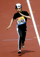 14-year-old Mareena Karim of Afghanistan competes in the womens 100m-T46 first round race during the 12th Paralympic Games in Athens