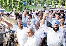 PU Senate poll counting staff raise slogans against an alleged "vulgar" remark by a supporter of a candidate