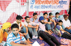 GNEC students on an indefinite fast along with their supporters outside the college in Ludhiana