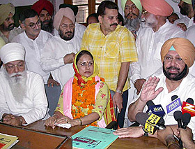 Ms Sukhjinder Rana, Congress candidate, flanked by Capt Amarinder Singh (right) and Mr H.S. Hanspal during the filing of nomination papers for the Kapurthala byelection on Wednesday.