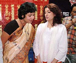 Distinguished Bangladeshi author Taslima Nasreen shares a light moment with Bengali film actress Debashree Roy 