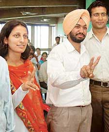 Four office-bearers of the PUCSC (from left) Rajwinder Singh Lucky, Ankita Thakur, Gurmukh Singh and Vikas Rathee, show the victory sign after the election results.