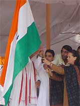 Congress President Sonia Gandhi and Mr Randeep Singh Surjewala, working President of the Indian Youth Congress, flag off trucks of wheat for the flood-affected areas in Bihar and Assam