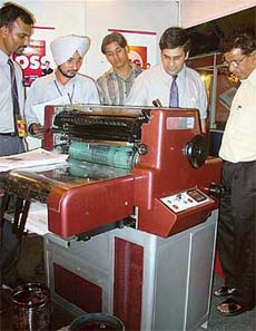 Visitors have a look at a mini offset machine, which was launched at North Print 2004 in Chandigarh