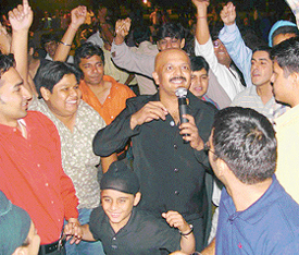 D.J. Narayan, a member of the music group Aryan, dances with the audience at Forest Hill, near Chandigarh, on Sunday night.