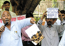 Activists of Krantikari Manuvadi Morcha burning the symbolic book of SCERT 