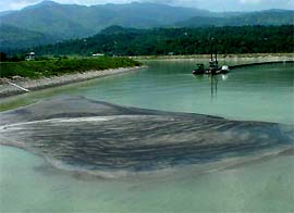 Silt dumped by the BBMB balancing reservoir at Sundernagar. A dredger is seen in the background. 