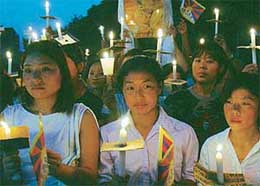 Tibetans take out a candle-light procession on the Panjab University campus in Chandigarh on Monday. 