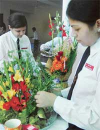 Students take part in the Flower arrangement competetion at Dr Ambedkar Institute for Hotel Management, Sector 42, Chandigarh, on the occasion of World Tourism Day on Monday. 
