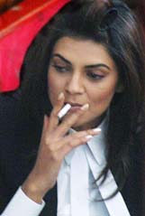 Bollywood actress Sushmita Sen smokes after completing a shot during the shooting of Harry Baweja's film Pyaar in Shimla on Monday. 