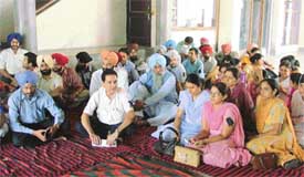 Teachers of the GNDEC stage dharna in Ludhiana on Monday