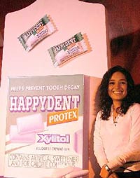 A model launches Happydent Protex, a sugar-free chewing gum, in New Delhi on Tuesday. 
