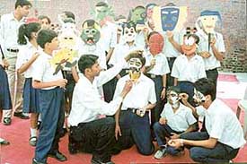 Children busy in mask making contest during the Open Talent Search Competition at Government Model Senior Secondary School, Sector 19, Chandigarh, on Tuesday.