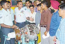 An Air Force officer explains the features of equipment displayed during Education & Employment Show and Recruitment Camp and Career Business Fair held at Lajpat Rai Bhavan, Sector-15, Chandigarh, on Tuesday.