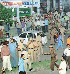 Policemen keep watch in Haripur village in Sector 4, Panchkula following protest by villagers against a demolition drive on Tuesday. 