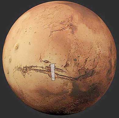 A handout picture taken by Mars Express shows a general view of Mars and a marked area north of Valles Marineris