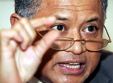 Opec President Purnomo Yusgiantoro gestures during a news conference in his office in Jakarta on Wednesday. Sky-high oil prices are not due to any fundamental imbalance and are being driven up by supply uncertainties that have instilled a "fear factor" into the market and increased speculative trade, the Opec head said. 