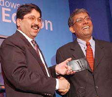 Union Minister of Communication and Information Technology Dayanidhi Maran with Chairman of Microsoft India Ravi Venkatesan (R) during the launch of Windows XP starter edition in New Delhi on Wednesday.