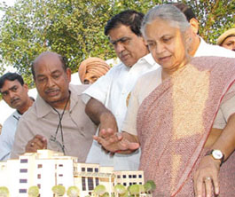 Delhi Chief Minister Sheila Dikshit having a good look at the model of Kisan Bhavan after laying down its foundation stone at Azadpur Sabzi Mandi in the Capital on Wednesday.