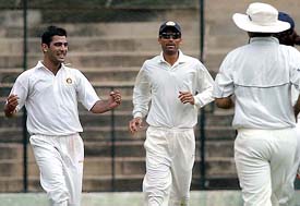 Amit Bandari of India A is all smiles after dismissing Akash Chopra of India Seniors during their practice match in Bangalore on Wednesday. 