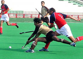 A forward of Western Railway tries to score a goal against Punjab Police at the SN Vohras 34th All India Gurmit Memorial Hockey Tournament 