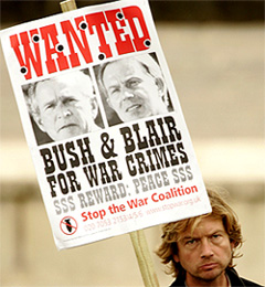 A peace campaigner carries an anti war placard outside the Labour Party conference in Brighton