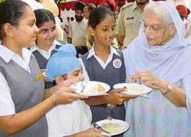 Ms Mohinder Kaur, mother of Capt Amarinder Singh, Chief Minister, interacts with students after inaugurating the junior wing building of Yadavindra Public School, SAS Nagar, on Thursday. 